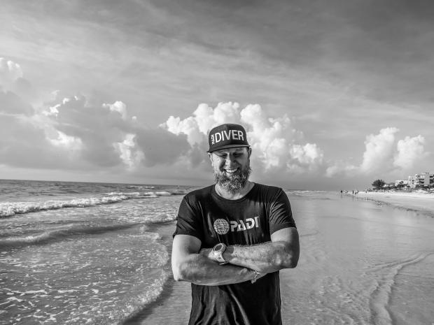 Thomas Koch smiling at the beach